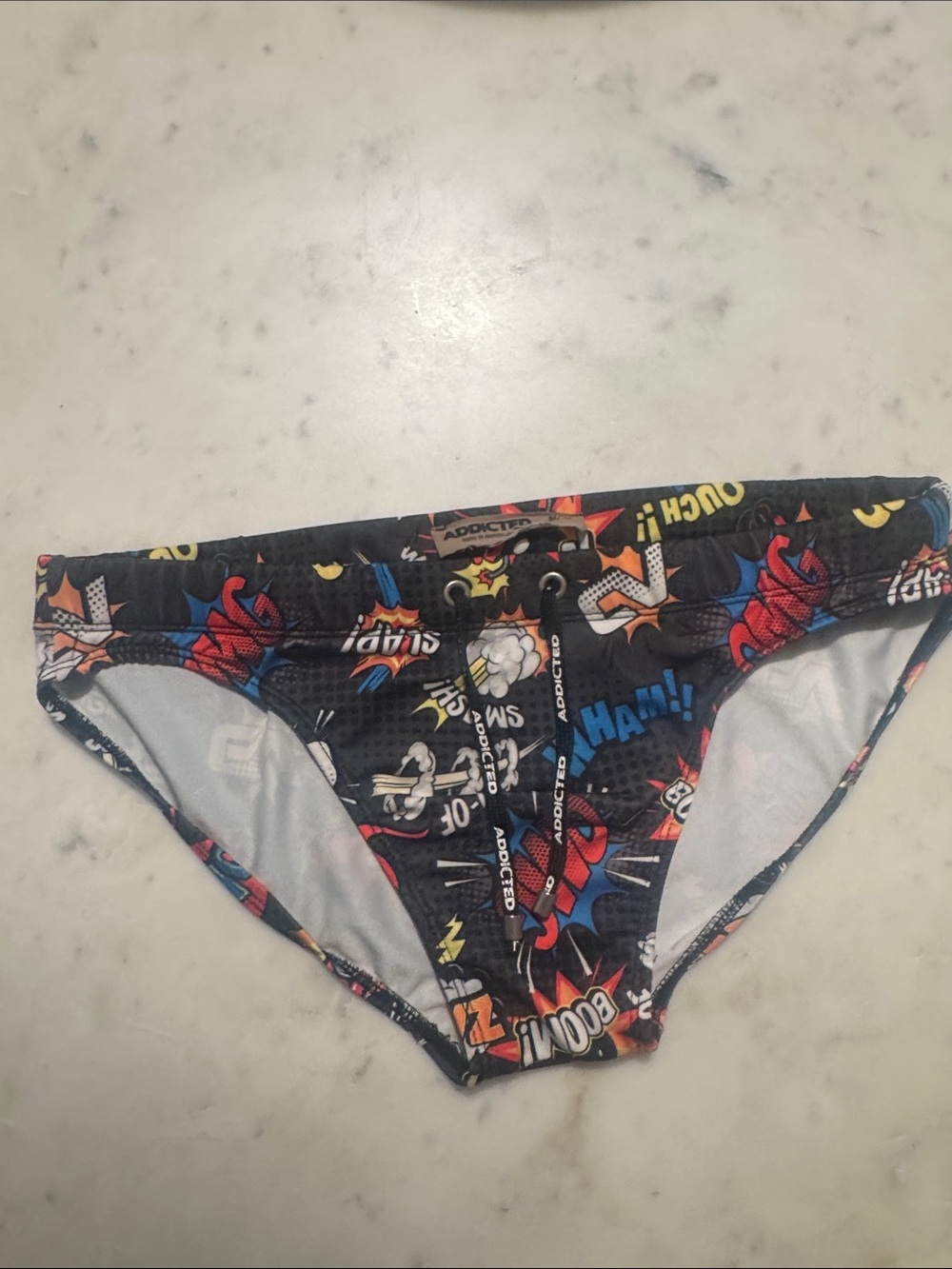 Addicted Brands Men’s Comic Print Swim Trunks - Black, Red, Blue, Yellow